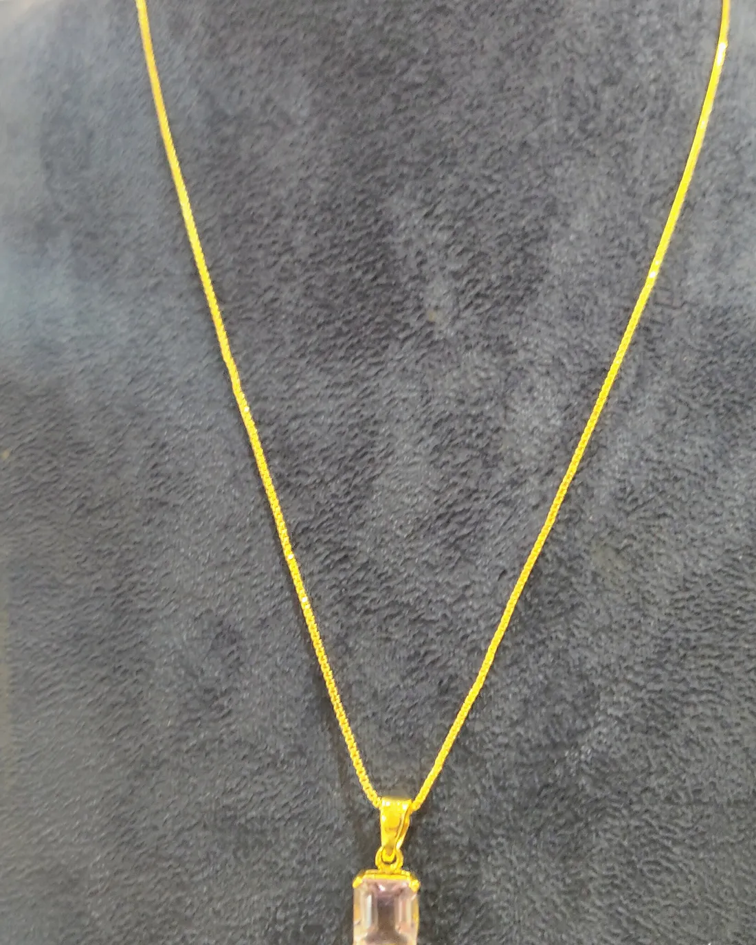 Pale stone pendant, view 2